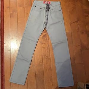 Grey Levi jeans with black buttons